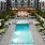a pool in a courtyard between buildings