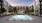 a pool in a courtyard between buildings