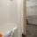 a bathroom with a bathtub and closet