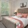 a bedroom with a bed and lamps