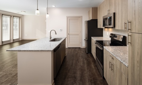 kitchen with ample counter-space, modern appliances and bright lighting