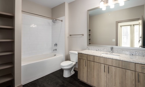 bathroom showing decor and a large mirror