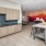 a kitchen with a table and chairs
