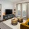 a living room with a tv and couches